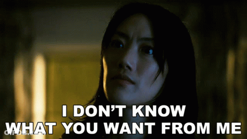 A Woman Says " I Don 'T Know What You Want From Me " In A Dark Room GIF