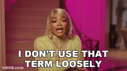 A Woman Says " I Don 'T Use That Term Loosely " In Front Of A Pink Background GIF