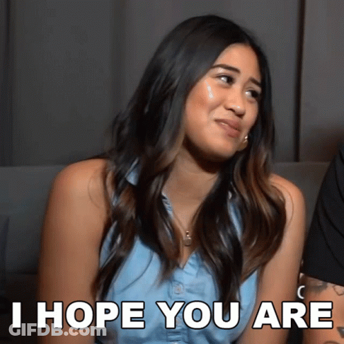 A Woman Says I Hope You Are While Looking At The Camera GIF