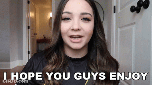 A Woman Says I Hope You Guys Enjoy In Front Of A Door GIF