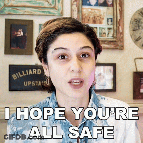 A Woman Says I Hope You 'Re All Safe In Front Of A Billiard Sign GIF