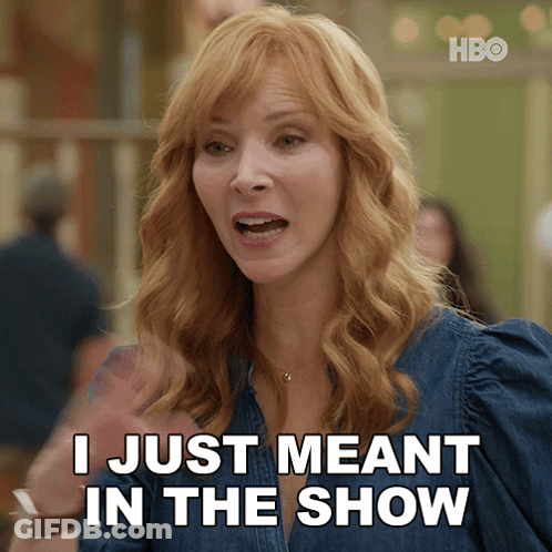 A Woman Says " I Just Meant In The Show " While Wearing A Denim Shirt GIF