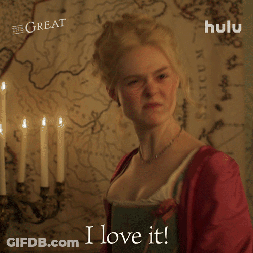A Woman Says " I Love It " In Front Of A Map And Candles GIF