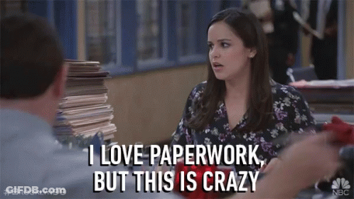 A Woman Says I Love Paperwork But This Is Crazy In Front Of A Pile Of Papers GIF