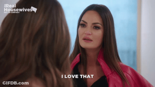 A Woman Says I Love That While Looking At Herself In The Mirror GIF