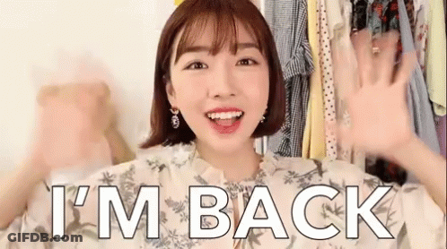 A Woman Says I 'M Back In Front Of A Closet Of Clothes GIF