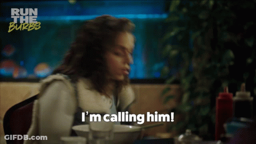 A Woman Says I 'M Calling Him While Sitting At A Table With A Bowl Of Food GIF