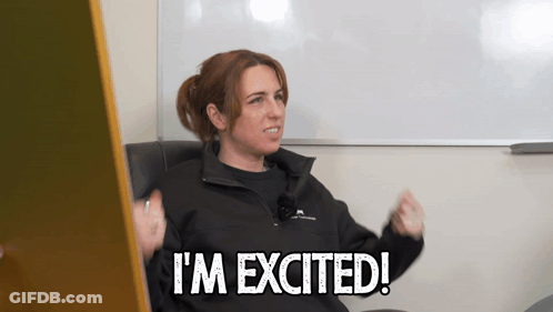 A Woman Says I 'M Excited In Front Of A Whiteboard GIF