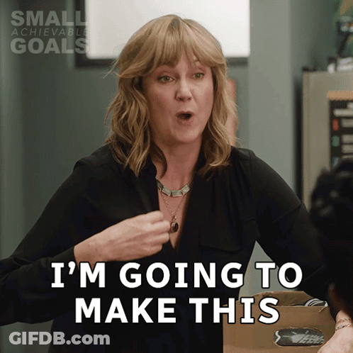 A Woman Says I 'M Going To Make This In Front Of A Small Achievable Goals Sign GIF
