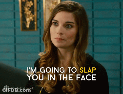 A Woman Says " I 'M Going To Slap You In The Face " In Yellow Letters GIF