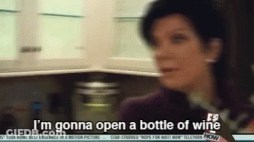 A Woman Says I 'M Gonna Open A Bottle Of Wine In A Kitchen GIF