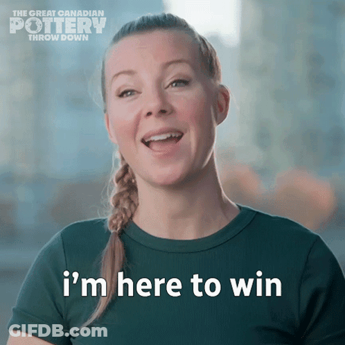 A Woman Says " I 'M Here To Win " In Front Of A Sign That Says The Great Canadian Pottery Throw Down GIF