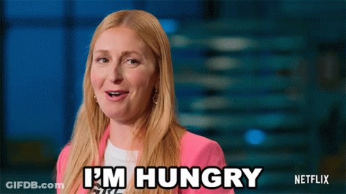 A Woman Says I 'M Hungry In A Pink Jacket GIF