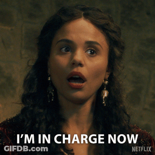 A Woman Says I 'M In Charge Now With A Netflix Logo Behind Her GIF
