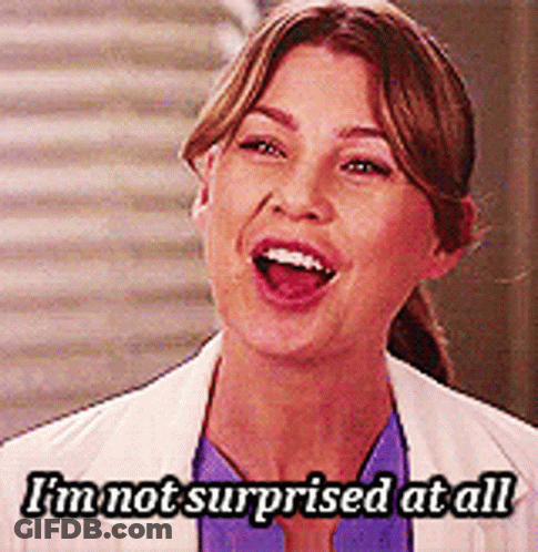 A Woman Says I 'M Not Surprised At All In Front Of A Staircase GIF