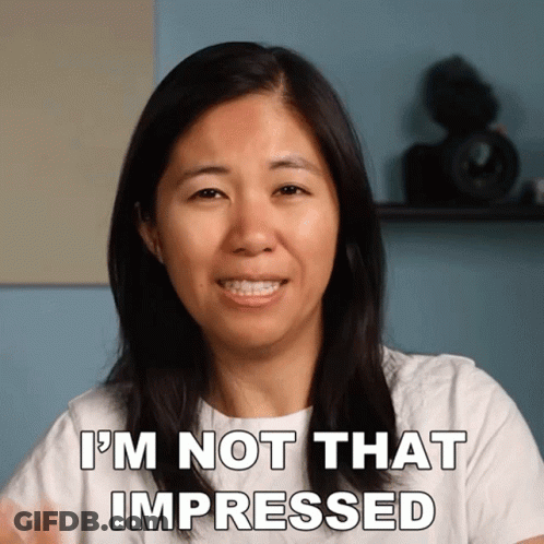 A Woman Says " I 'M Not That Impressed " While Smiling GIF
