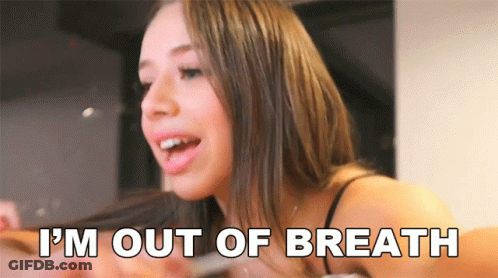 A Woman Says " I 'M Out Of Breath " In Front Of Her Face GIF