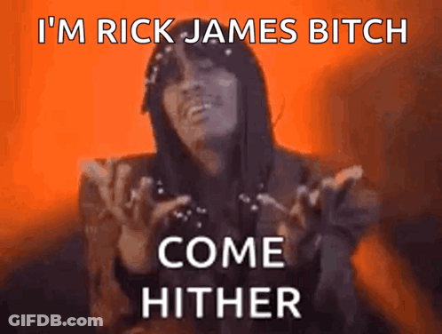 A Woman Says " I 'M Rick James Bitch Come Hither " In Front Of An Orange Background GIF
