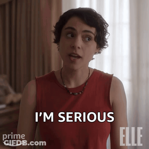 A Woman Says I 'M Serious In A Red Shirt GIF