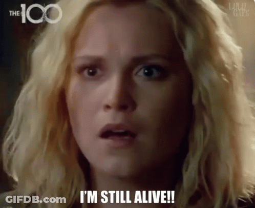 A Woman Says I 'M Still Alive In Front Of A 100 Logo GIF