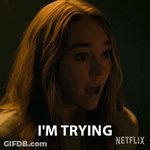 A Woman Says I 'M Trying In A Dark Room GIF
