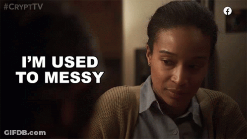 A Woman Says " I 'M Used To Messy " While Looking Down At Something GIF