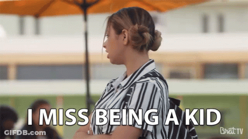 A Woman Says I Miss Being A Kid While Standing Under An Umbrella GIF