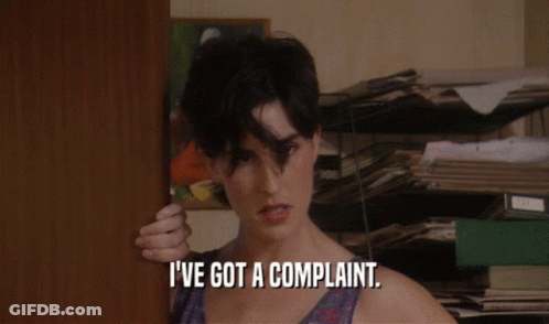 A Woman Says I 'Ve Got A Complaint While Standing In Front Of A Door GIF