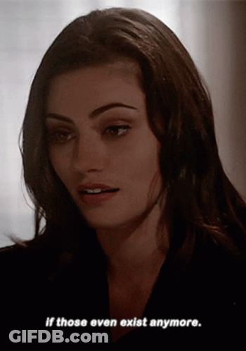 A Woman Says " If Those Even Exist Anymore " In A Dark Room GIF