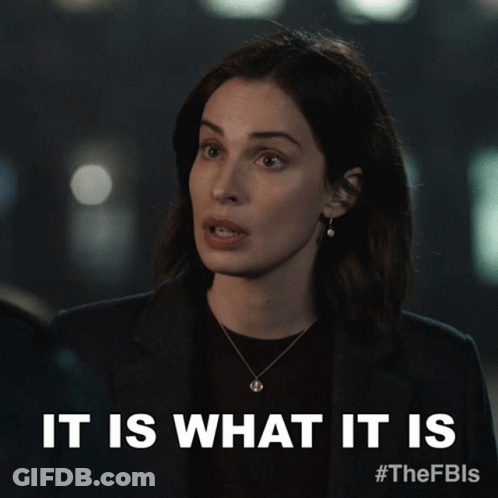 A Woman Says It Is What It Is While Wearing A Necklace GIF