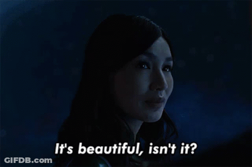 A Woman Says It 'S Beautiful Isn 'T It In A Dark Room GIF