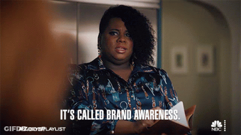 A Woman Says It 'S Called Brand Awareness While Holding A Clipboard GIF