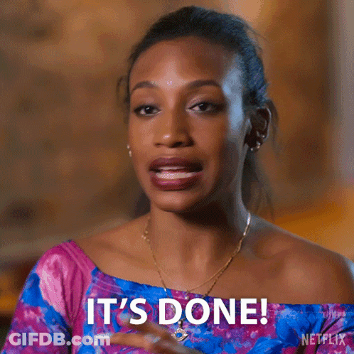 A Woman Says It 'S Done While Wearing A Pink And Blue Top GIF