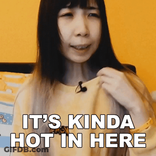 A Woman Says It 'S Kinda Hot In Here In Front Of A Yellow Background GIF