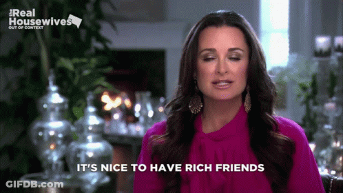 A Woman Says It 'S Nice To Have Rich Friends On A Screen GIF
