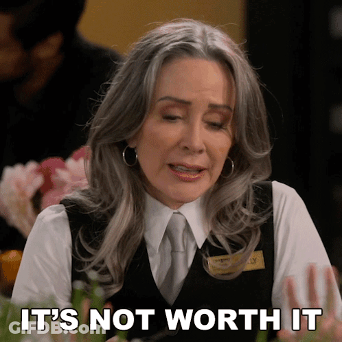 A Woman Says It 'S Not Worth It While Wearing A Vest And Tie GIF