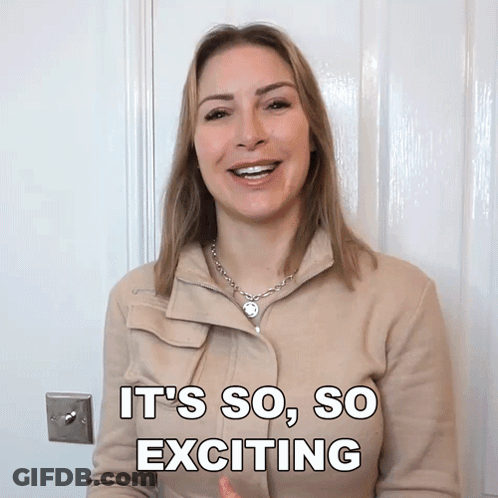 A Woman Says It 'S So So Exciting While Standing In Front Of A Door GIF
