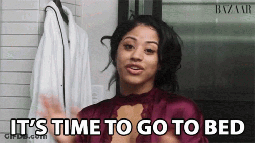 A Woman Says It 'S Time To Go To Bed In Front Of A White Coat GIF