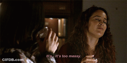 A Woman Says It 'S Too Messy While Holding A Glass Of Wine GIF