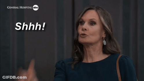 A Woman Says " Just Zip It " In Front Of A General Hospital Logo GIF