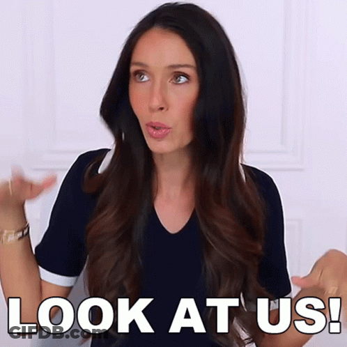 A Woman Says " Look At Us " In Front Of Her GIF