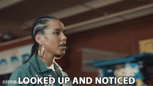 A Woman Says Looked Up And Noticed In Front Of A Brick Wall GIF