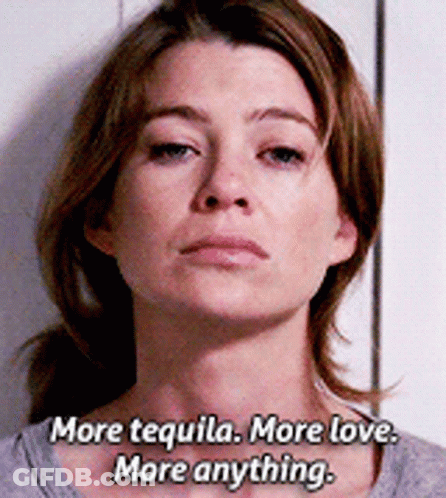 A Woman Says " More Tequila More Love More Anything " In Front Of A White Wall GIF