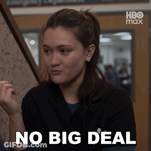 A Woman Says No Big Deal In Front Of A Hbo Max Sign GIF