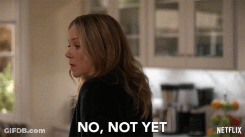 A Woman Says No Not Yet In Front Of A Netflix Logo GIF