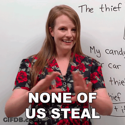 A Woman Says " None Of Us Steal " In Front Of A White Board GIF
