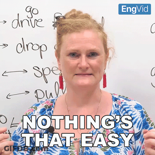 A Woman Says Nothing 'S That Easy In Front Of A White Board With Writing On It GIF