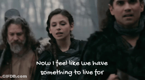 A Woman Says " Now I Feel Like We Have Something To Live For " In Front Of A Man And Woman GIF