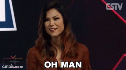 A Woman Says Oh Man In Front Of A Tv GIF