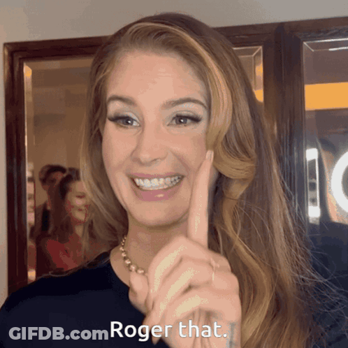 A Woman Says Roger That With Her Finger GIF